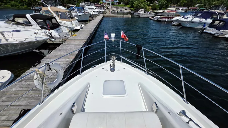  Yacht Photos Pics 2005 Carver 36 Mariner docked at a marina, surrounded by other boats.