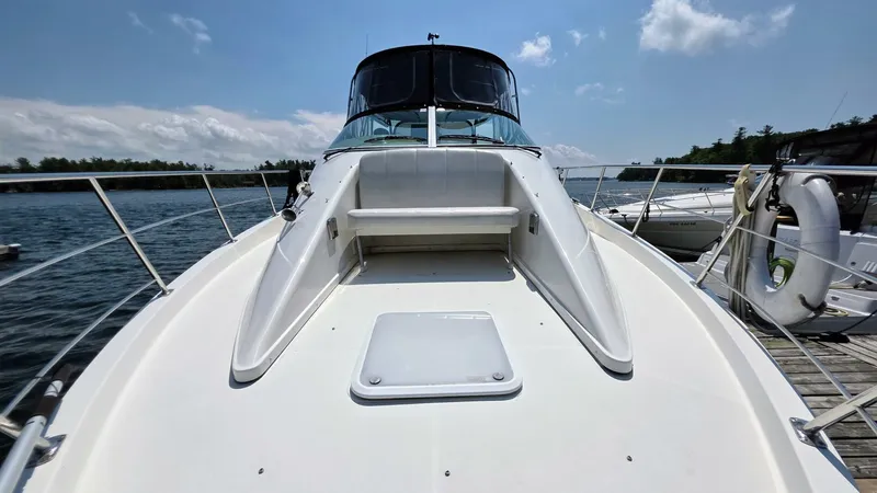  Yacht Photos Pics 2005 Carver 36 Mariner yacht docked, showcasing spacious deck and sleek design under clear skies.