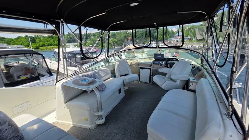  Yacht Photos Pics 2005 Carver 36 Mariner interior with spacious seating and helm, docked at marina.