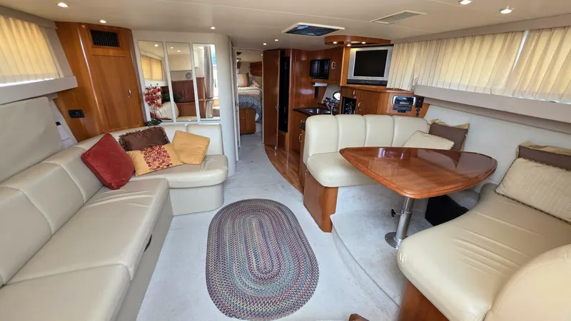  Yacht Photos Pics Luxurious interior of a 2005 Carver 36 Mariner yacht with plush seating and elegant decor.