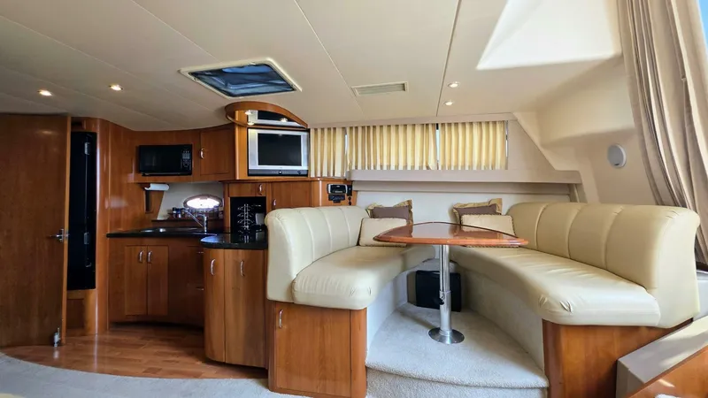  Yacht Photos Pics Interior of 2005 Carver 36 Mariner yacht with cozy seating and modern amenities.