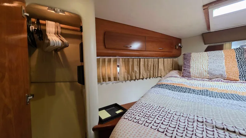  Yacht Photos Pics Interior of 2005 Carver 36 Mariner with cozy bed and closet space.