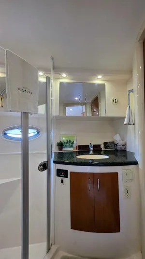  Yacht Photos Pics Luxurious bathroom in 2005 Carver 36 Mariner yacht with modern fixtures and elegant design.