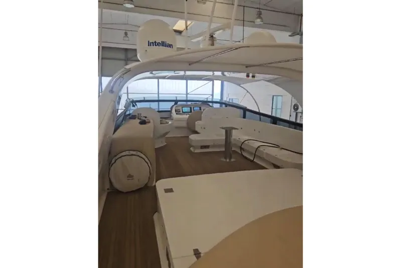  Yacht Photos Pics Luxurious 2004 Maiora 24 S yacht interior with modern navigation equipment and seating.