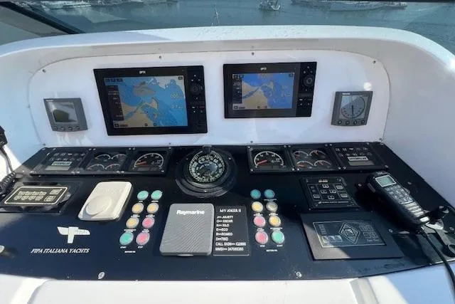  Yacht Photos Pics Control panel of a 2004 Maiora 24 S yacht with navigation screens and instruments.
