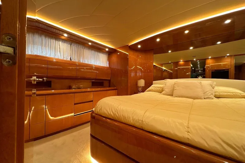  Yacht Photos Pics Luxurious Maiora 24 S yacht bedroom interior with elegant wood finish and ambient lighting, 2004 model.