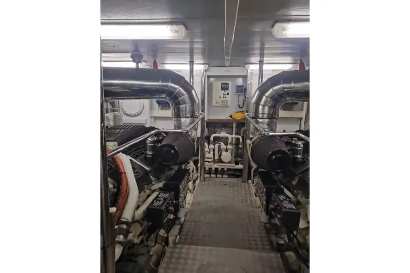  Yacht Photos Pics Engine room of 2004 Maiora 24 S yacht with visible machinery and equipment.