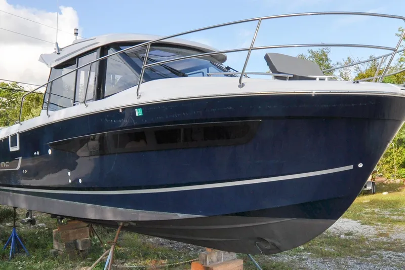 Samaya Lu Yacht Photos Pics 2020 Jeanneau NC 895 boat on stands, blue hull, outdoor setting.