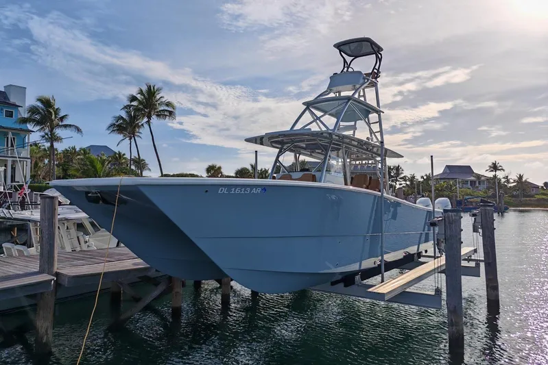  Yacht Photos Pics 2025 Freeman 42 boat docked at marina with palm trees and clear sky.