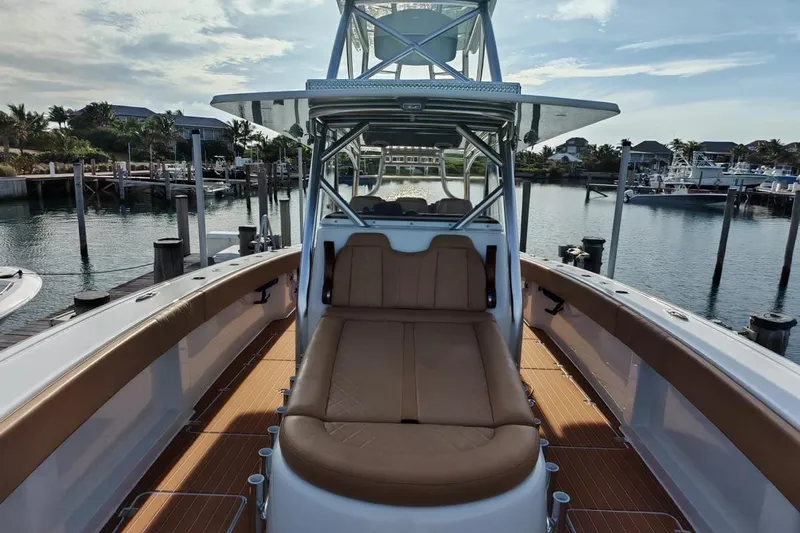  Yacht Photos Pics 2025 Freeman 42 boat with spacious deck and seating, docked at a marina.