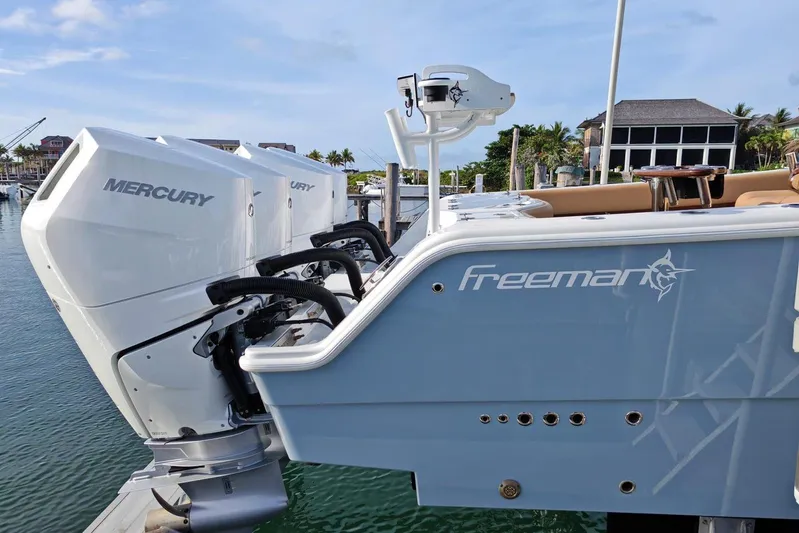  Yacht Photos Pics Freeman 42 boat with dual Mercury engines docked in a marina, 2025 model.