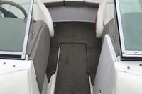Interior of a 2003 Cobalt 200 boat with white seating and dual windshields.