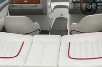 Interior of a 2003 Cobalt 200 boat with white seating and red accents.