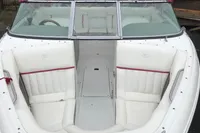 2003 Cobalt 200 boat with white interior and red accents, featuring spacious seating.
