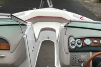 Interior view of a 2003 Cobalt 200 boat, featuring dashboard and seating area.