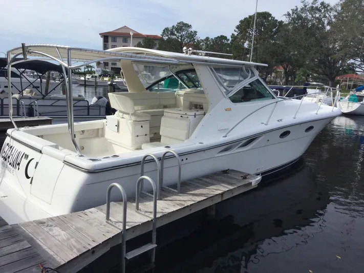  Yacht Photos Pics 1998 Tiara Yachts 3500 Open docked, showcasing sleek design and spacious deck.