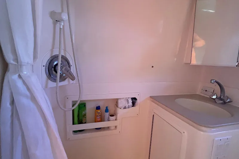 Yacht Photos Pics Bathroom interior of 1998 Tiara Yachts 3500 Open with shower and sink.