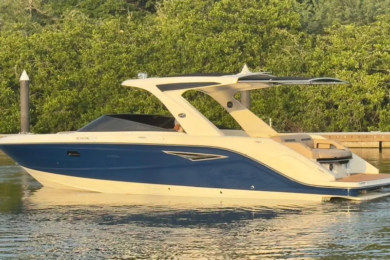 2017 Sea Ray 310 Slx @ Puerto Vallarta "bella" Yacht Photos Pics 2017 Sea Ray 310 SLX boat on calm water, surrounded by lush greenery.