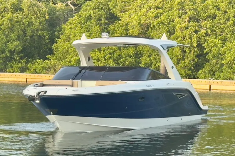 2017 Sea Ray 310 Slx @ Puerto Vallarta "bella" Yacht Photos Pics 2017 Sea Ray 310 SLX boat cruising on calm water with lush greenery background.