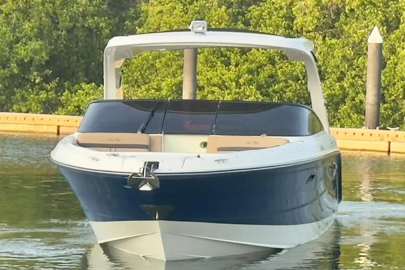 2017 Sea Ray 310 Slx @ Puerto Vallarta "bella" Yacht Photos Pics 2017 Sea Ray 310 SLX boat on calm water, surrounded by greenery.