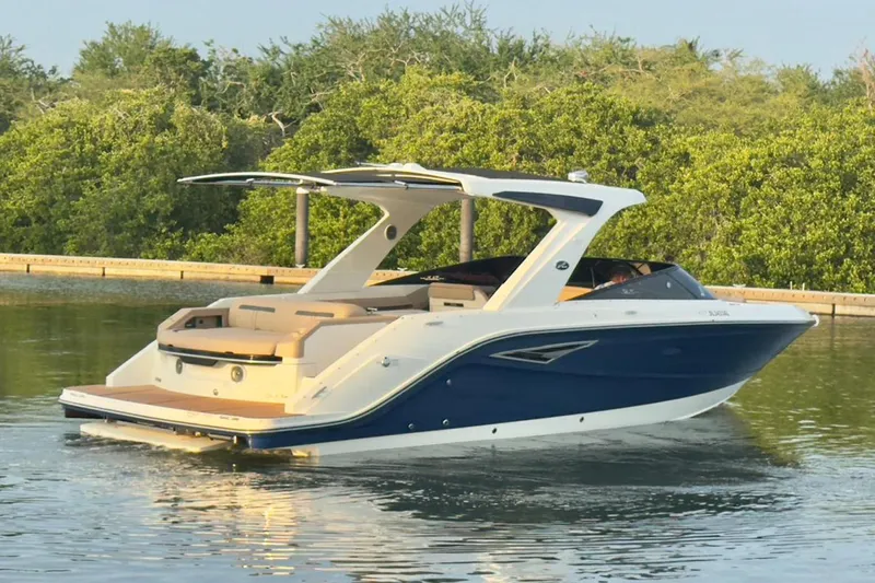 2017 Sea Ray 310 Slx @ Puerto Vallarta "bella" Yacht Photos Pics 2017 Sea Ray 310 SLX boat cruising on calm water near lush greenery.