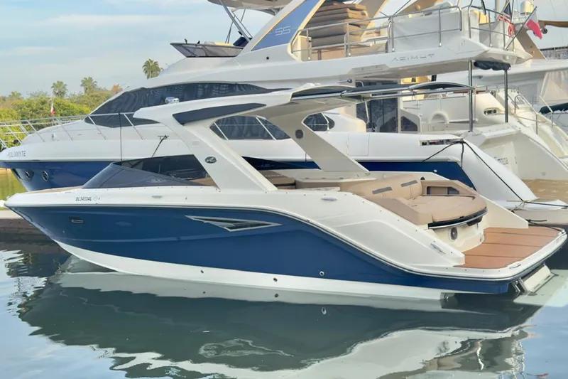 2017 Sea Ray 310 Slx @ Puerto Vallarta "bella" Yacht Photos Pics 2017 Sea Ray 310 SLX boat docked, featuring sleek design and blue hull.