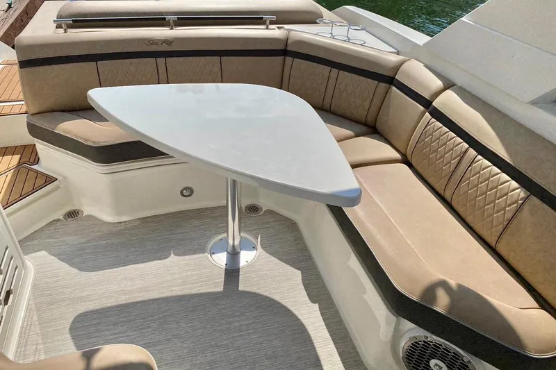 2017 Sea Ray 310 Slx @ Puerto Vallarta "bella" Yacht Photos Pics Luxurious seating area on a 2017 Sea Ray 310 SLX boat with a sleek table.