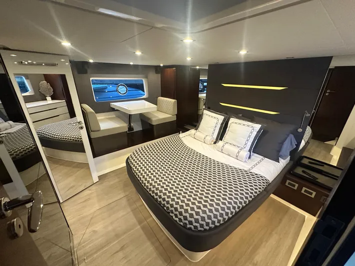 American Dream Yacht Photos Pics Luxurious cabin interior of 2023 Schaefer 660 yacht with modern decor and comfortable bedding.