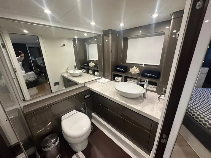 American Dream Yacht Photos Pics Luxurious bathroom in 2023 Schaefer 660 yacht with modern fixtures and elegant design.