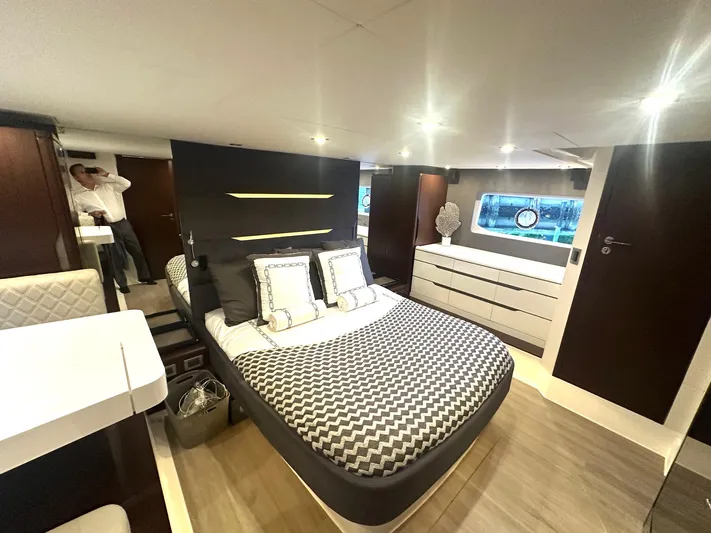 American Dream Yacht Photos Pics Luxurious bedroom interior of 2023 Schaefer 660 yacht with modern design and elegant furnishings.