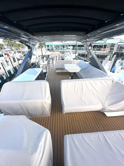 American Dream Yacht Photos Pics Luxury Schaefer 660 yacht deck with seating, 2023 model, docked at marina.