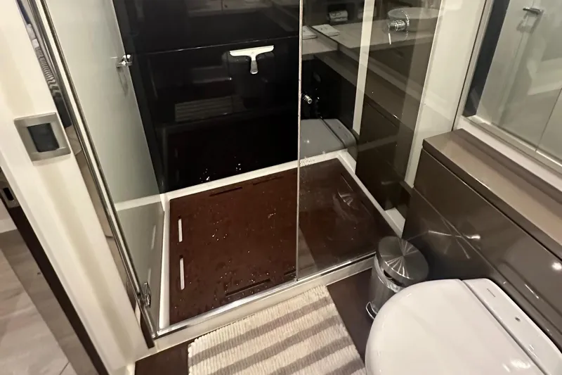 American Dream Yacht Photos Pics Modern bathroom in 2023 Schaefer 660 yacht with glass shower and sleek fixtures.