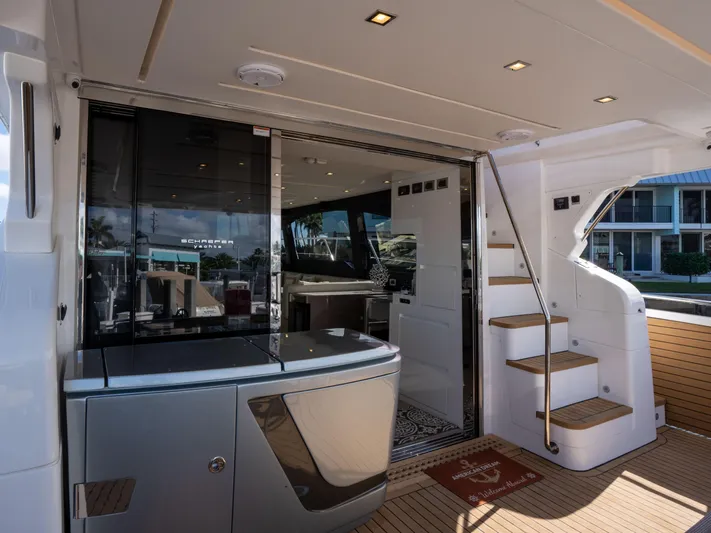American Dream Yacht Photos Pics Luxury interior of 2023 Schaefer 660 yacht with modern design and wooden flooring.