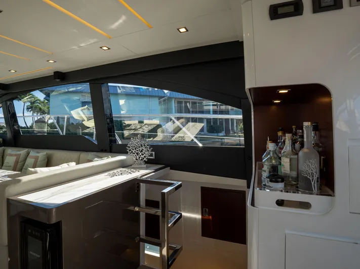 American Dream Yacht Photos Pics Luxurious interior of 2023 Schaefer 660 yacht with modern bar and seating area.