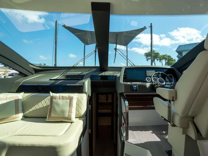 American Dream Yacht Photos Pics Luxurious interior of 2023 Schaefer 660 yacht with modern helm and seating.