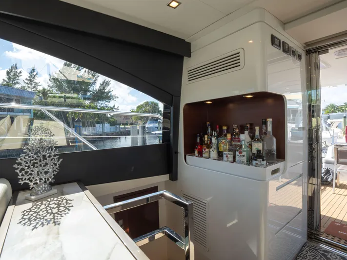American Dream Yacht Photos Pics Luxury interior of 2023 Schaefer 660 yacht with bar and scenic window view.