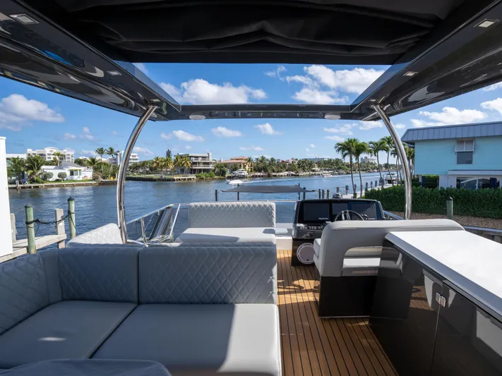 American Dream Yacht Photos Pics Luxurious 2023 Schaefer 660 yacht interior with waterfront view, featuring modern seating and sleek design.