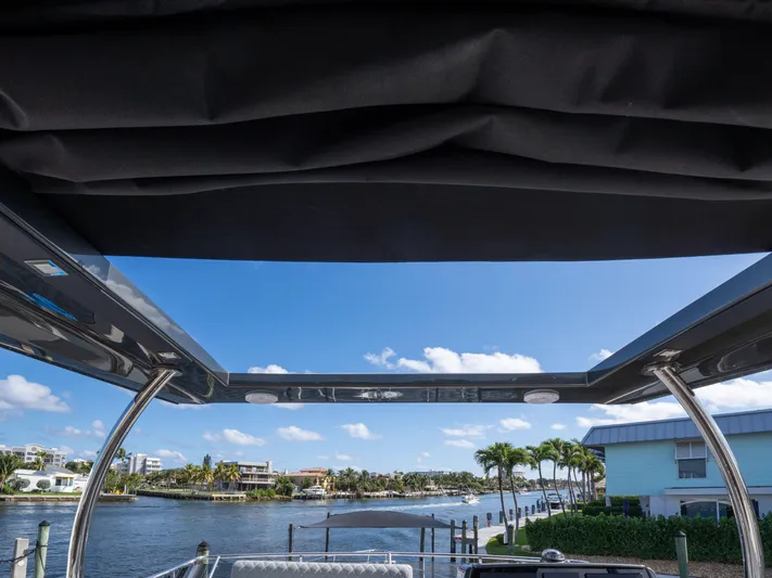 American Dream Yacht Photos Pics View from Schaefer 660 yacht, 2023 model, overlooking a serene waterfront scene.