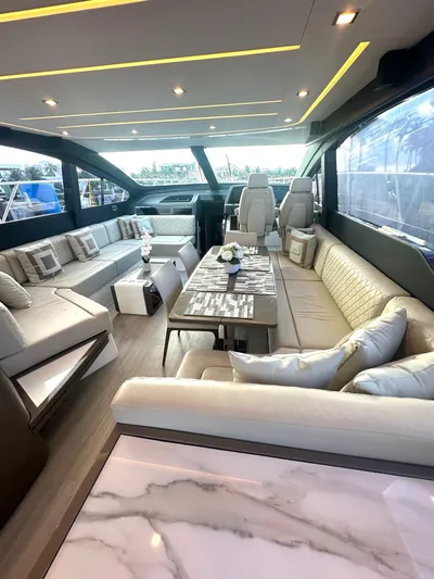 American Dream Yacht Photos Pics Luxurious interior of 2023 Schaefer 660 yacht with modern seating and elegant decor.
