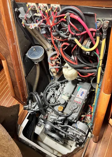 Weagle Yacht Photos Pics Engine compartment of a 2002 Jeanneau 43DS sailboat, showing wiring and mechanical components.