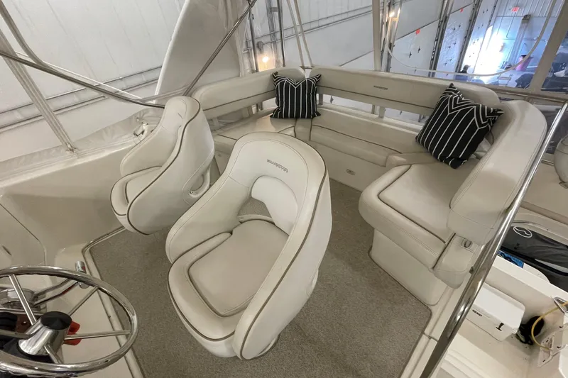 Northern Comfort Yacht Photos Pics 2005 Silverton 34 Convertible yacht interior with plush seating and striped cushions.