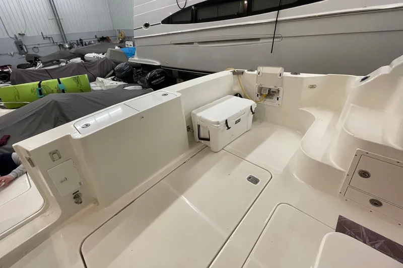 Northern Comfort Yacht Photos Pics 2005 Silverton 34 Convertible boat interior with storage and cooler in a marina setting.