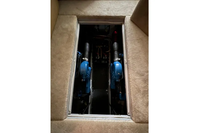 Northern Comfort Yacht Photos Pics Engine compartment of a 2005 Silverton 34 Convertible boat, showcasing dual engines.