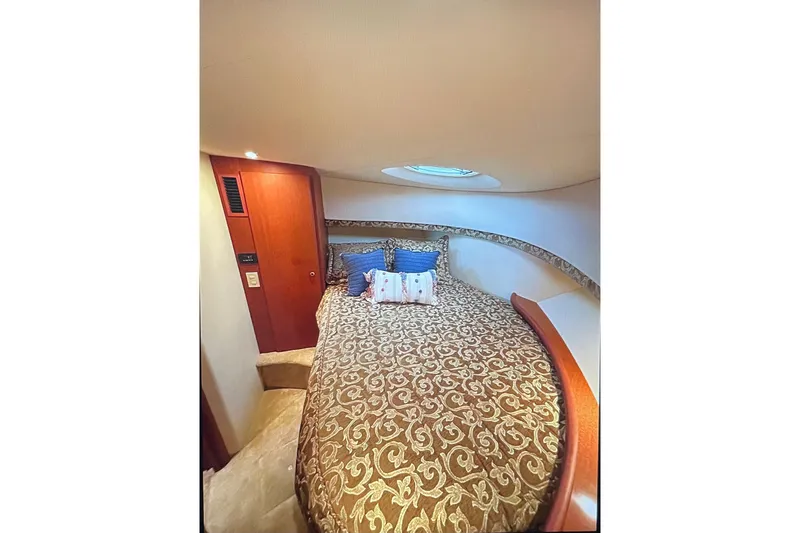 Northern Comfort Yacht Photos Pics Luxurious cabin interior of 2005 Silverton 34 Convertible yacht with elegant bedding.