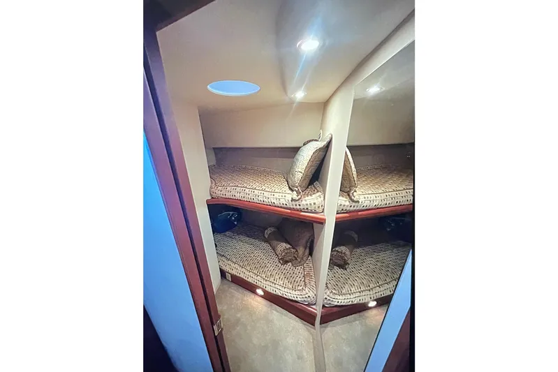 Northern Comfort Yacht Photos Pics 2005 Silverton 34 Convertible cabin with cozy bunk beds and ambient lighting.