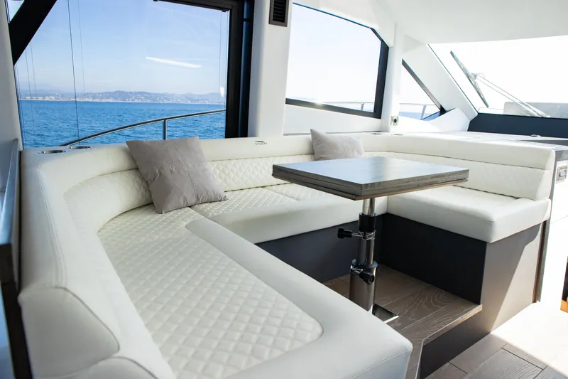  Yacht Photos Pics Luxurious interior of 2021 Galeon 460 Fly yacht with elegant seating and ocean view.