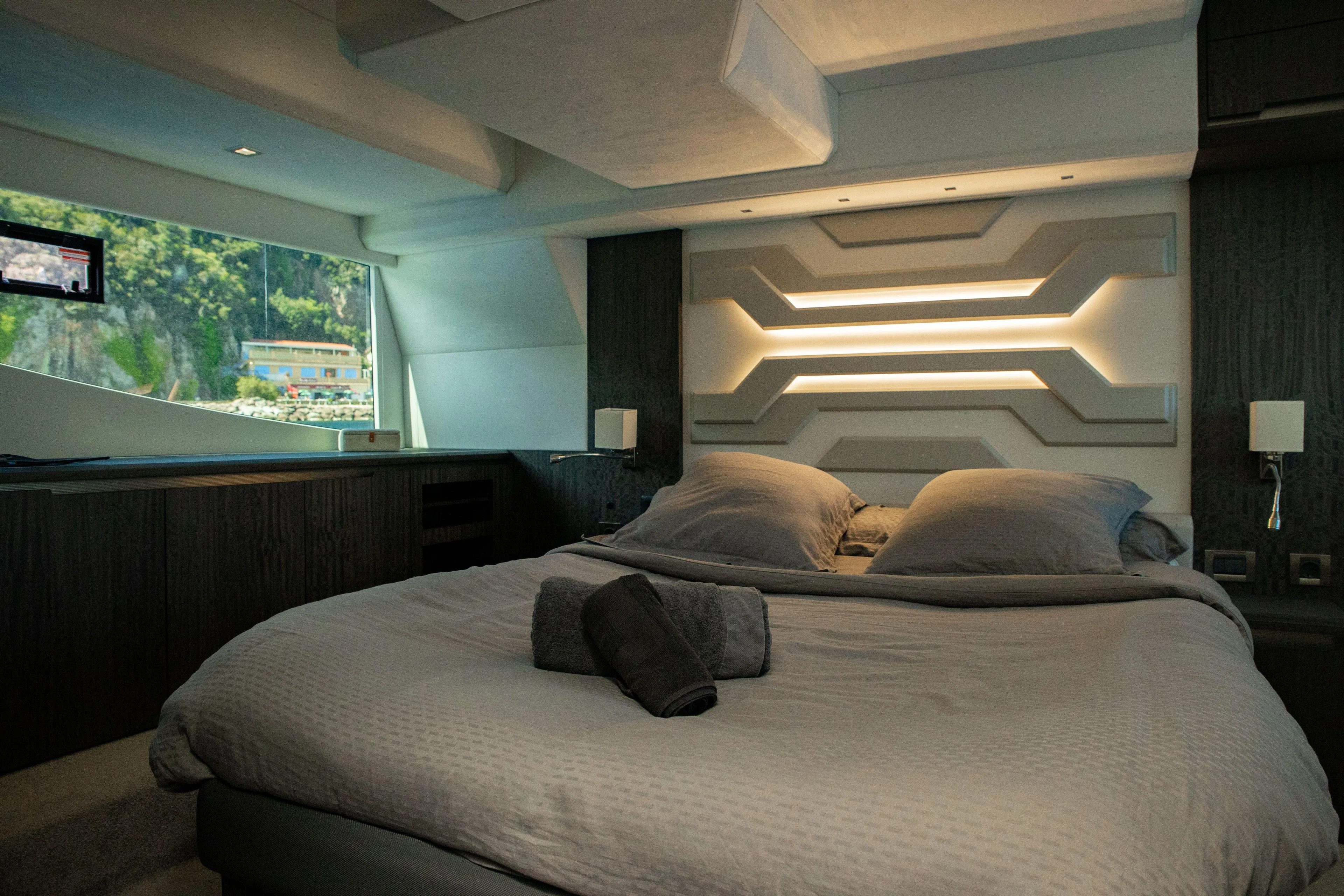  Yacht Photos Pics Luxurious bedroom interior of 2021 Galeon 460 Fly yacht with modern design and scenic window view.