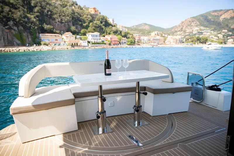  Yacht Photos Pics Luxury seating area on 2021 Galeon 460 Fly yacht with scenic coastal view.