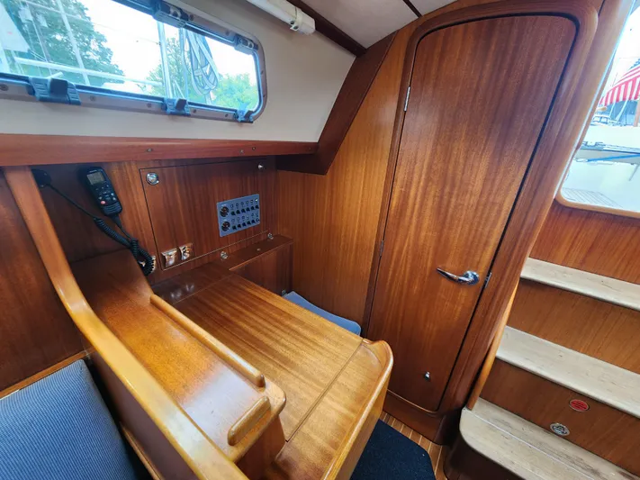 Ceres Yacht Photos Pics 2016 Hallberg-Rassy 342 interior with wooden finish and navigation station.