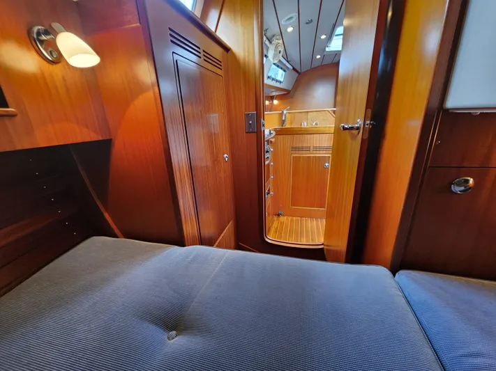 Ceres Yacht Photos Pics Interior of 2016 Hallberg-Rassy 342 yacht, featuring cozy wooden cabin and comfortable seating.